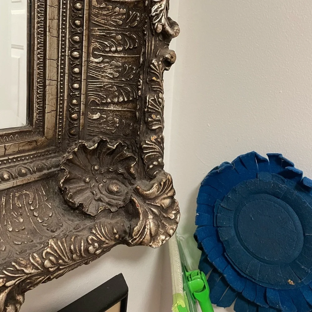 Beautiful carved mirror with little pearls in the oyster shells and much carving